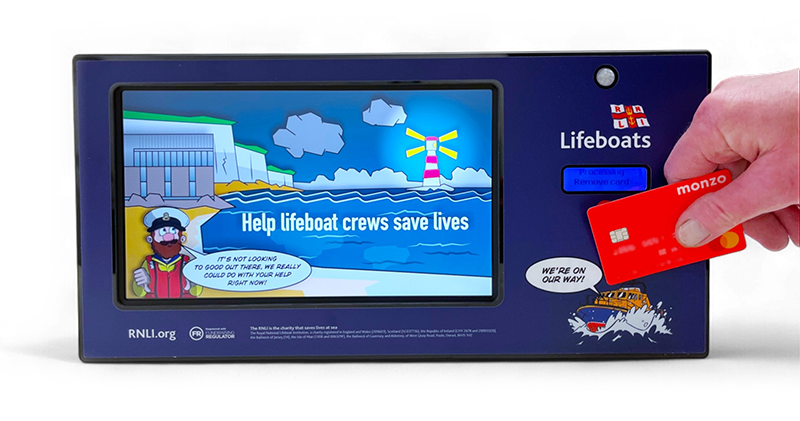 Image of a contactless donation being made on a bespoke donation box for RNLI.